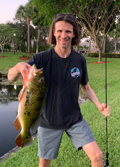Season Schelin Holding a Fish Relatable Fun Photo